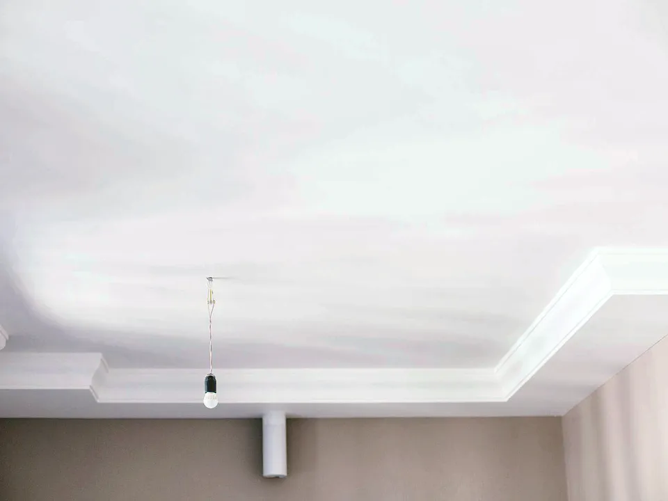Close-up of white crown molding at the ceiling