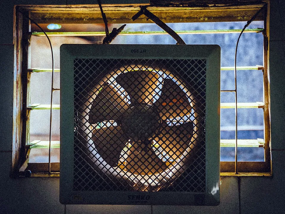 Close-up of a square exhaust fan grille