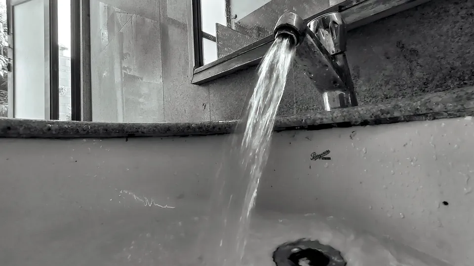 Water running into a sink drain