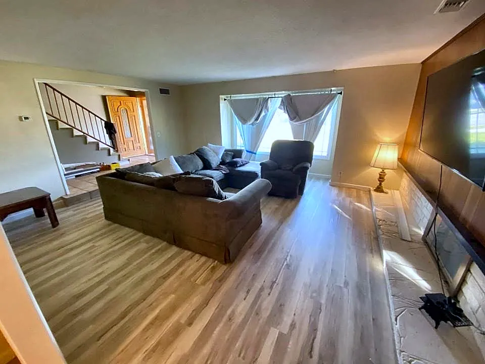 Living room with new wood-look vinyl plank floor