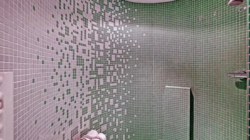 Bathroom with green mosaic wall tile