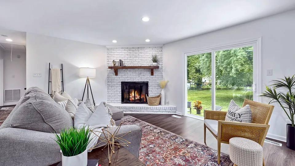 Living room with a large sliding glass door to the yard