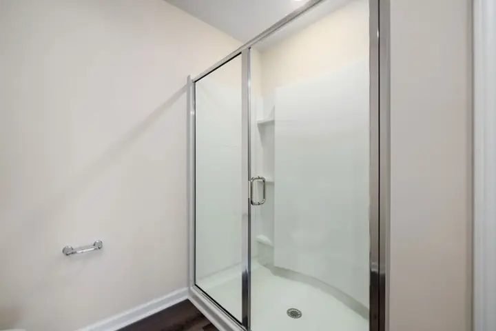 Contemporary glass shower with minimalist design, showing clean interior